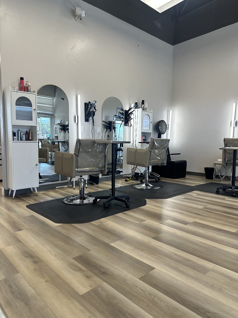 Two hair stations with arched mirrors