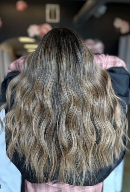Blonde balayage on long wavy hair